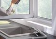 fold-down-function_window-installation_grandmother-cleaning-window_ambiance_4x3